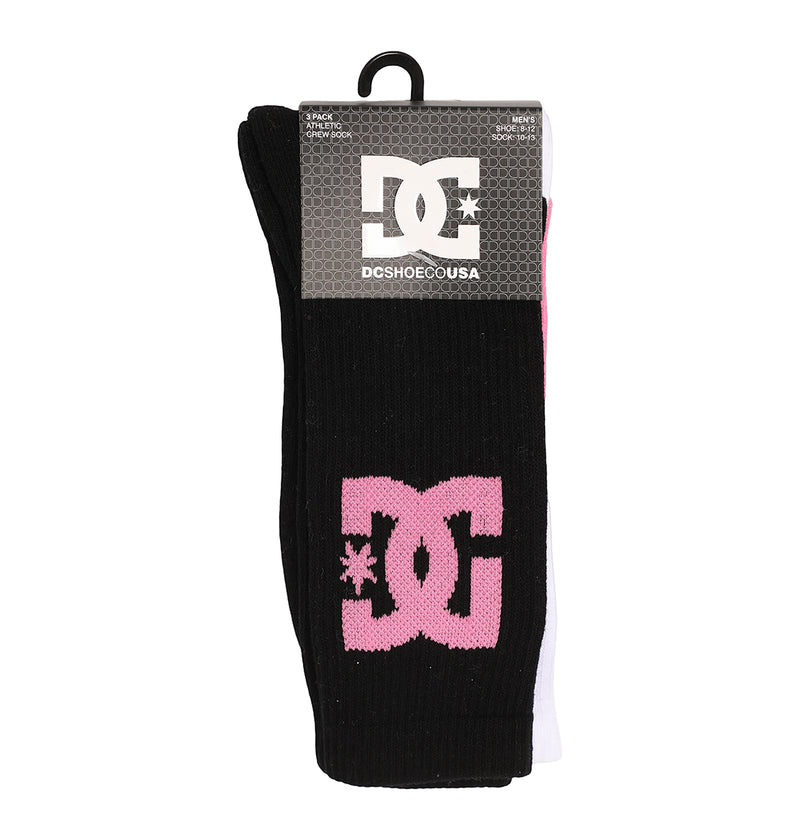 The DC Shoes Big Star Logo Crew Socks 3-Pack features black and white socks with a pink DC logo on the visible black sock, attached to a cardboard label displaying the DC Shoes USA logo.