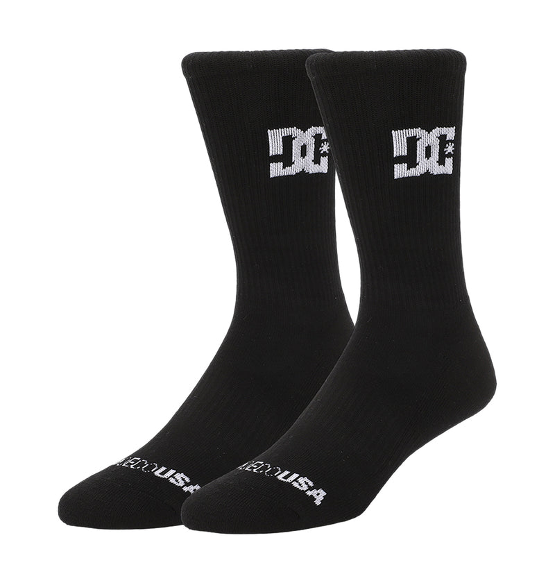 A 6-pack of black DC Shoes crew socks, each with a white DC logo on the sides and "DC SHOES USA" text at the toes, shown on a white background.