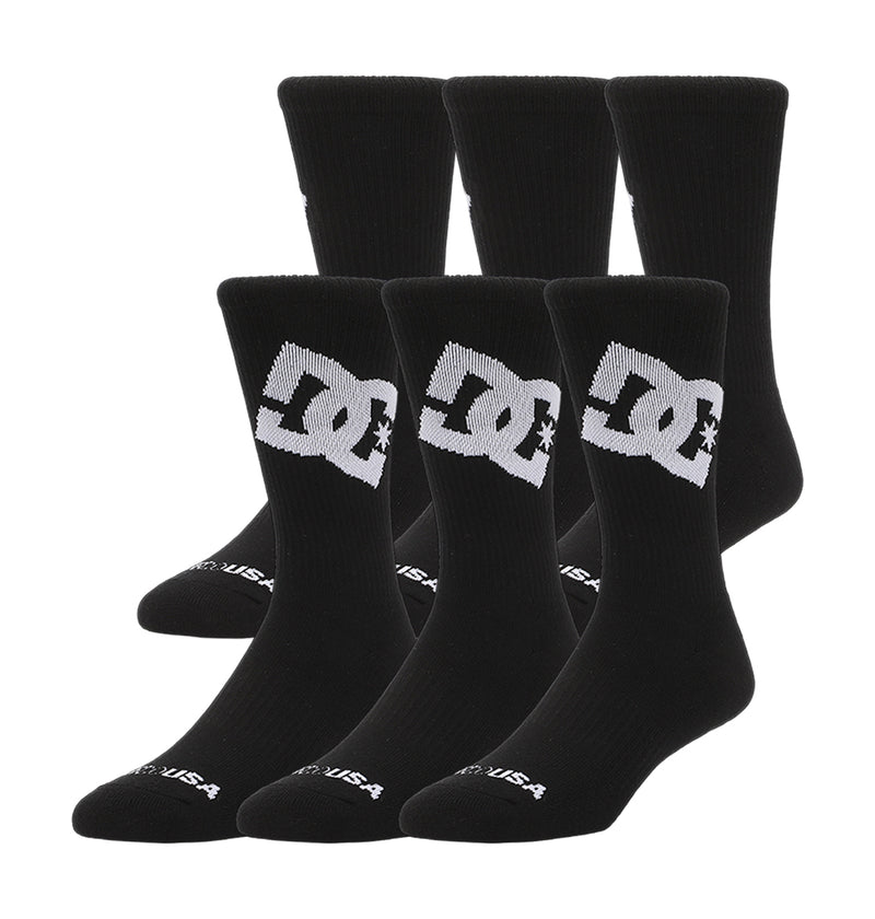 Two rows of DC Shoes Graffik Logo Crew Socks 3-Pack (black with large white DC logo and star), totaling six pairs.