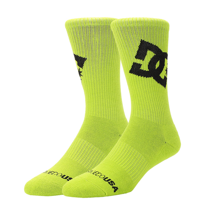 The DC Shoes Graffik Logo Crew Socks 3-Pack features neon yellow crew socks with black DC logos on the sides, DCSHOECOUSA on the toes, and ribbed cuffs and toes for enhanced comfort and fit.