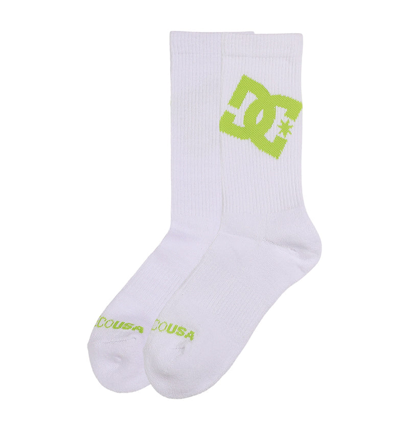 The DC Shoes Graffik Logo Crew Socks 3-Pack includes white crew socks with a bold green DC logo on the sides and DCOUSA text in green on the toes.