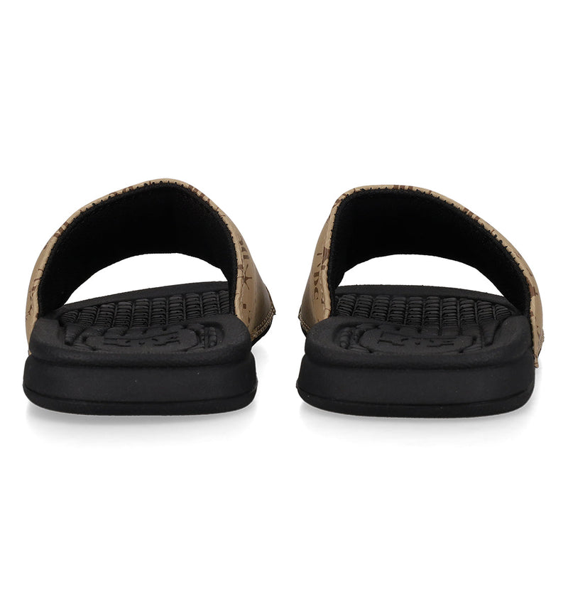The Kids' Bolsa Slides by DC Shoes feature tan open-toe uppers, thick black soles, and cushioned, textured footbeds for all-day comfort—perfect, comfy sandals viewed from the front.