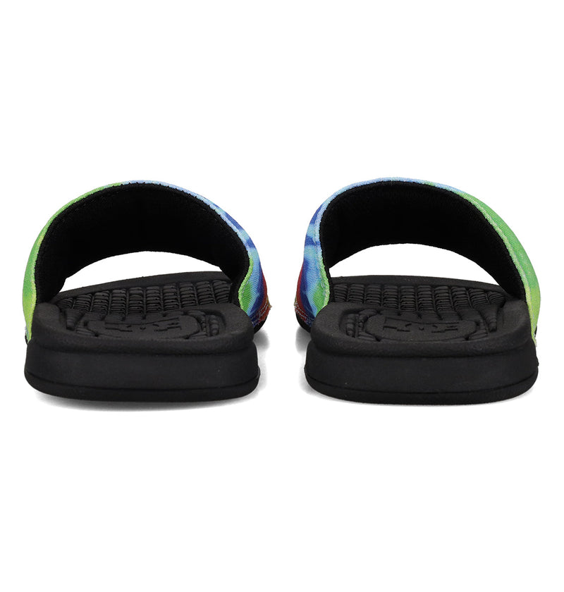 A front-facing view of DC Shoes Kids' Bolsa Slides featuring black soles and colorful tie-dye straps—comfy, vibrant open-toe sandals for everyday wear.