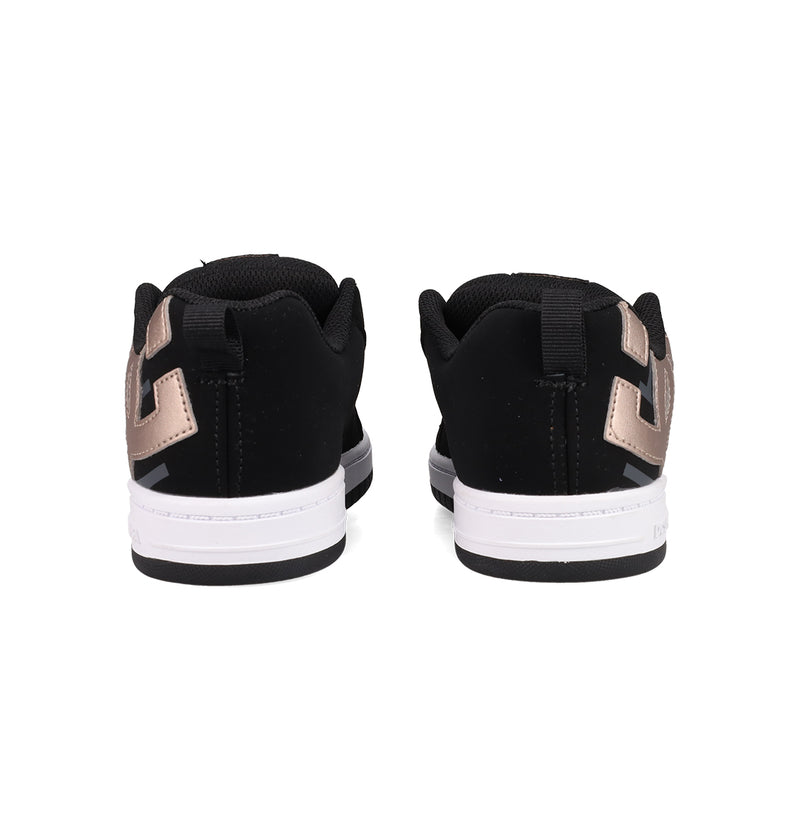 The Kids’ Court Graffik Shoes by DC Shoes are shown from the back in black and white with metallic accents, highlighting their classic puffy silhouette and detailed heel and sole against a white background.