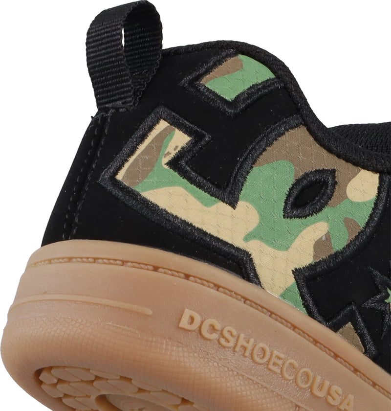 Close-up of the heel on Kids' Court Graffik Shoes by DC Shoes, featuring a large green camo DC logo, tan rubber sole embossed with DCSHOECOUSA, black heel pull tab, and the signature puffy silhouette for comfort.