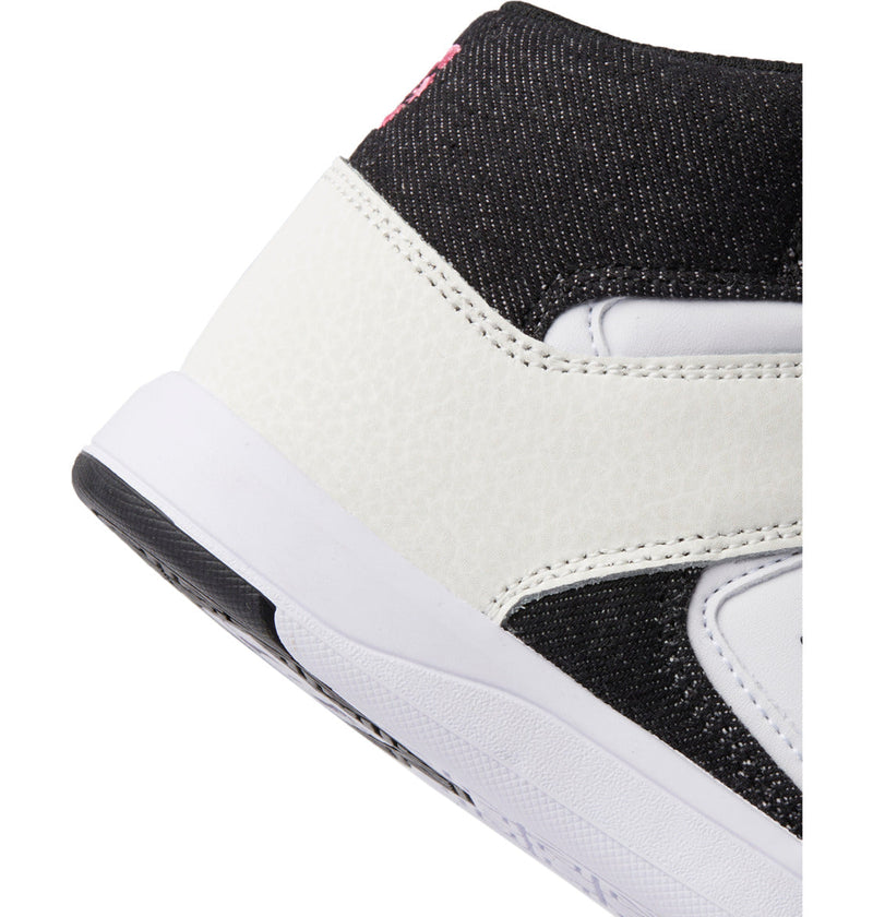 Close-up of the heel and sole of DC Shoes Kids' Cure High-Top Shoes, featuring a black upper, white textured leather accents, a white midsole, red stitching detail, and an abrasion-resistant rubber outsole.