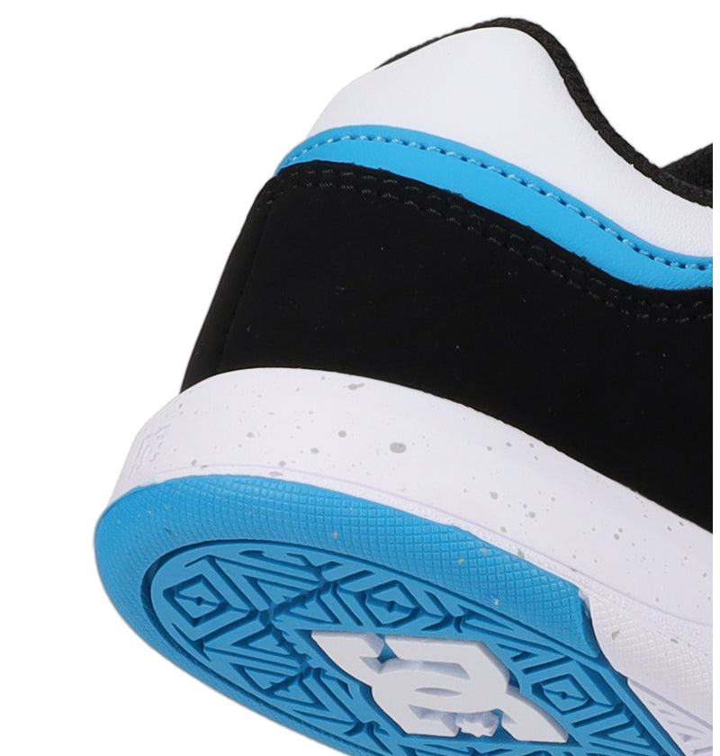Close-up of the heel and sole of the DC Shoes Cure by DC Shoes, featuring a black, white, and blue design. The speckled white midsole and patterned blue outsole are accented with a white DC logo.
