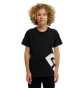 A young person with curly blonde hair wears the DC Shoes DC Lanai Tee Youth, a black relaxed-fit skate shirt with a bold white graphic on one side, standing against a plain white background.