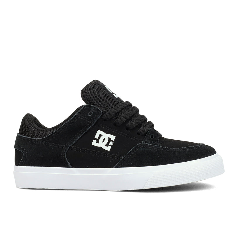 The Kids' Onyx Shoes by DC Shoes feature a minimal black design with a white logo, black laces, and a white rubber sole—displayed in side profile on a plain white background. Perfect for everyday style and comfort.