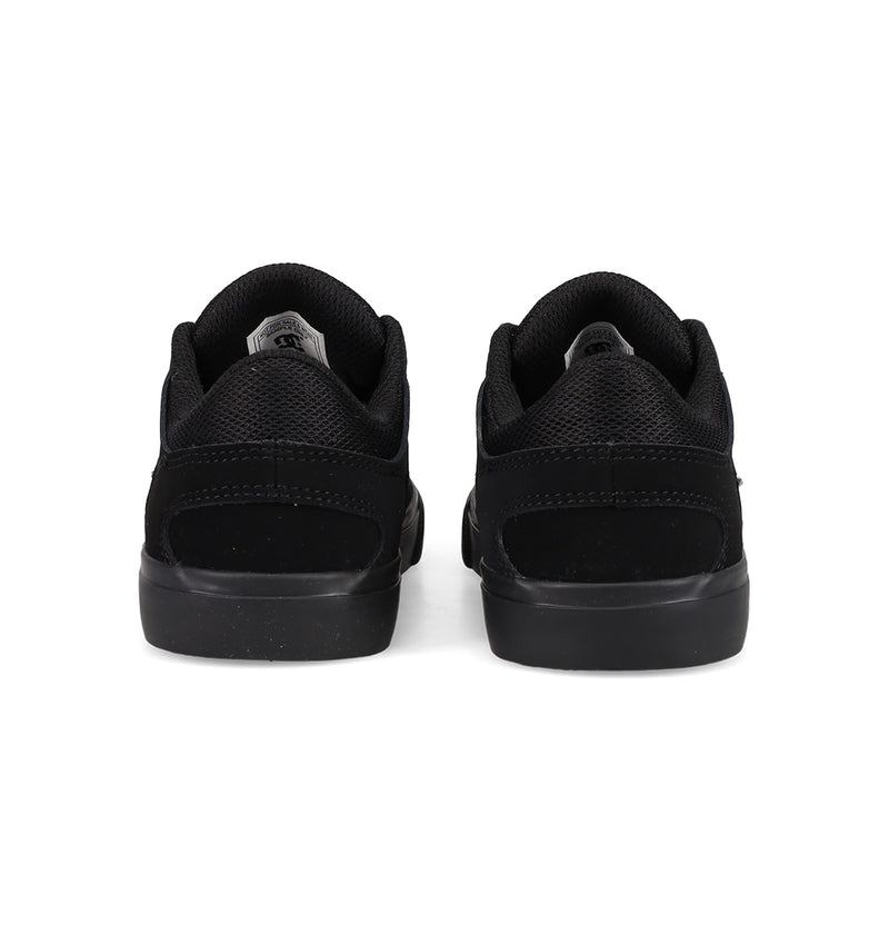 A pair of Kids' Onyx Shoes by DC Shoes, featuring a minimal black silhouette, are shown from the back side by side on a white background—perfect everyday sneakers.