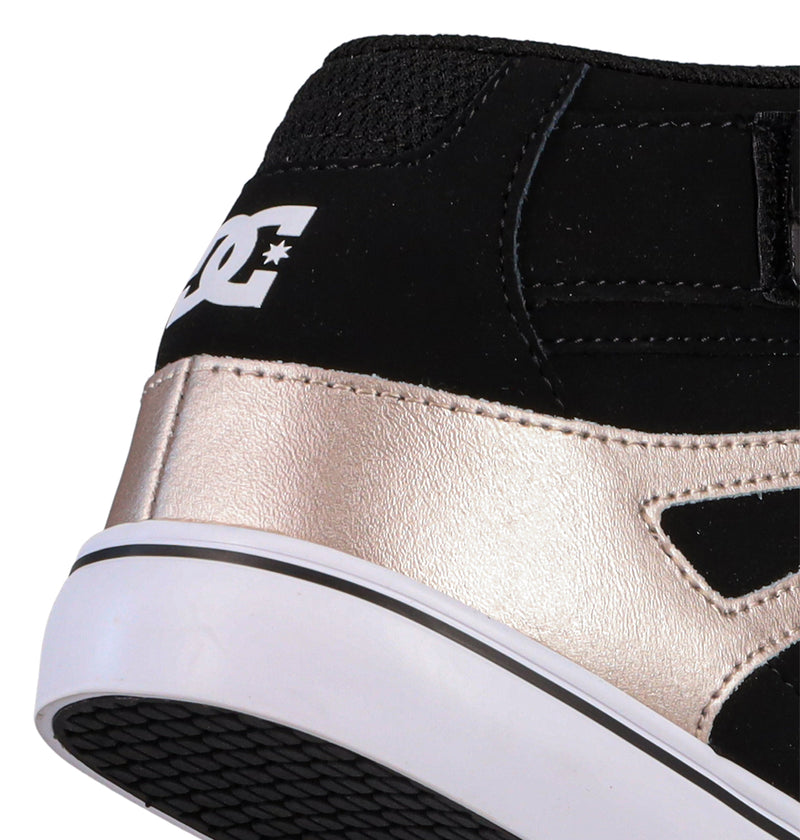 Close-up of the heel of the Kids' Pure Hi Top EV Shoes by DC Shoes, in black with metallic gold and white accents. The iconic logo appears near the ankle, and the white vulcanized outsole features a sleek black stripe.