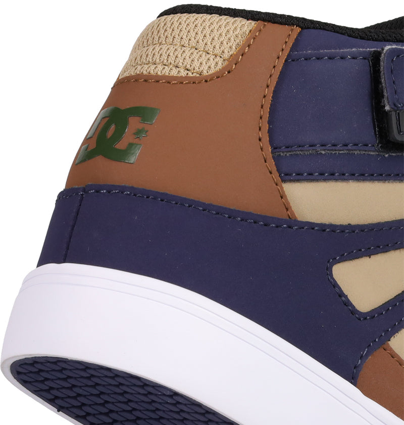 Close-up of the heel of DC Shoes Kids' Pure Hi Top EV, featuring tan, brown, and navy panels, a green DC logo, black mesh, and a white and purple rubber sole—ideal for young fans of stylish skate shoes.