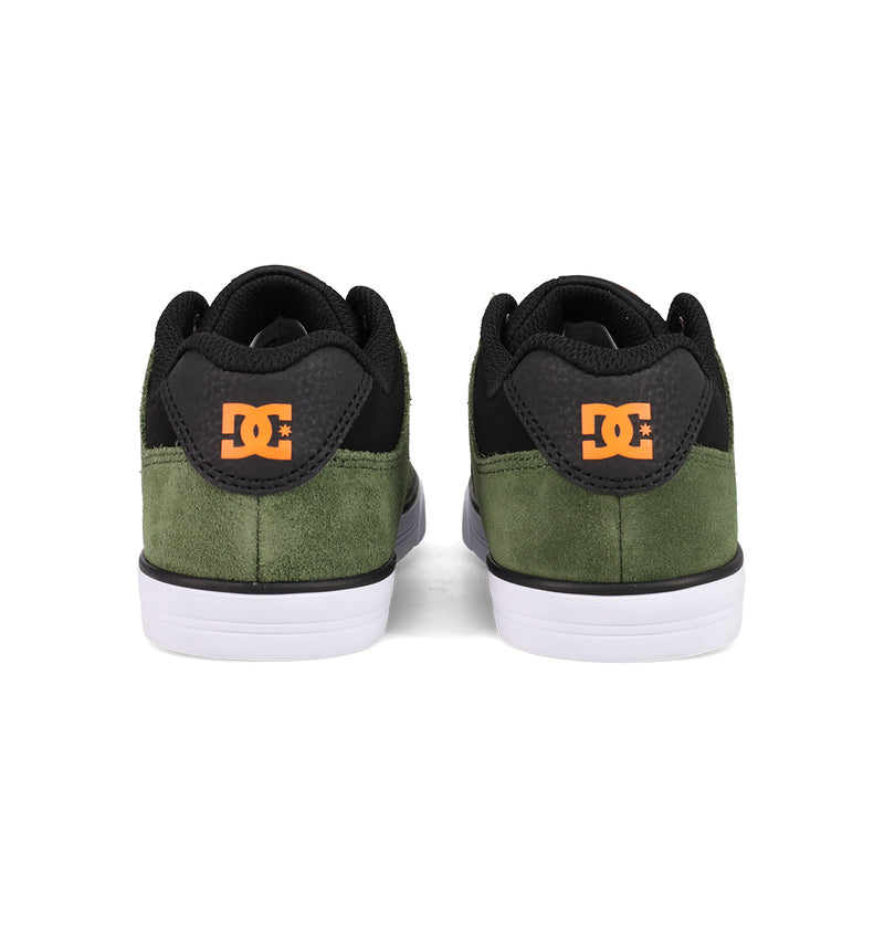 A pair of DC Shoes Kids' Pure Shoes seen from the back, with green suede uppers, black accents, white soles, and orange DC logos on each heel—stylish and comfortable footwear for kids.