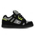 The DC Shoes Kids' Stag is a low-top skate shoe in black, grey, and neon green with a minimal silhouette, thick sole, mesh detailing, black laces, and the DC Shoes logo—perfect for everyday wear.