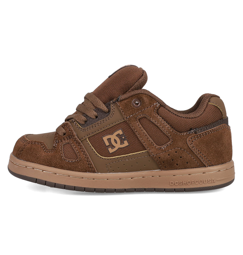 The Kids' Stag Shoes by DC Shoes feature brown suede and leather panels, a mesh tongue, side perforations, a gold DC logo, and durable cupsole construction. Presented in a classic skate silhouette against a white background.