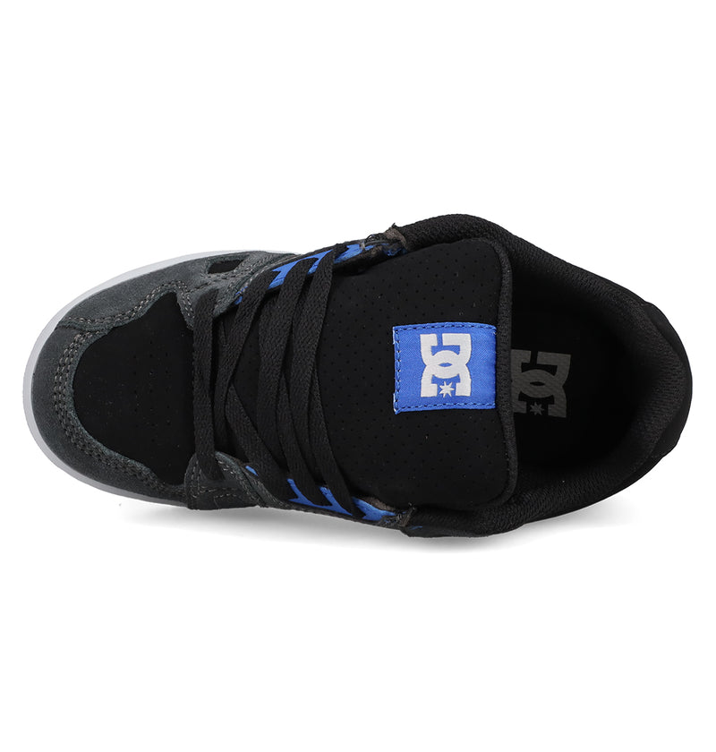 Top view of the Kids' Stag Shoes by DC Shoes in black and gray, featuring black laces, a blue and white DC logo on the tongue, suede and mesh details, and a durable cupsole.