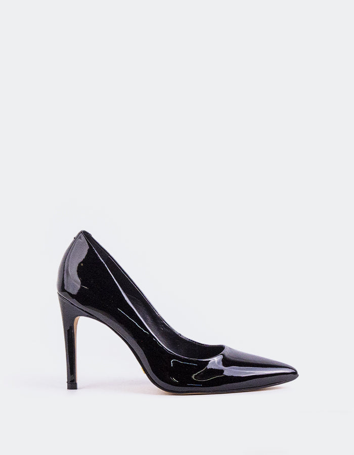 Chic Low Heel Pump
Designed for effortless elegance, this low heel pump offers the perfect balance of style and comfort. Its understated silhouette makes it ideal for both professional and casual settings, while the modest heel provides all-day wearability without compromising on sophistication. A go-to option for polished, everyday wear.

Detail(s):&nbsp;

Pointy Toe
3.75” Straight Stiletto Heel
We recommend sizing up, as this item runs small.

Material(s):&nbsp;

Patent Leather Upper&nbsp;
Padded Leather