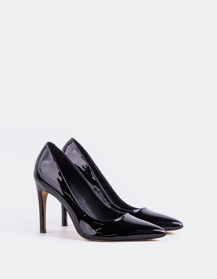 Chic Low Heel Pump
Designed for effortless elegance, this low heel pump offers the perfect balance of style and comfort. Its understated silhouette makes it ideal for both professional and casual settings, while the modest heel provides all-day wearability without compromising on sophistication. A go-to option for polished, everyday wear.

Detail(s):&nbsp;

Pointy Toe
3.75” Straight Stiletto Heel
We recommend sizing up, as this item runs small.

Material(s):&nbsp;

Patent Leather Upper&nbsp;
Padded Leather