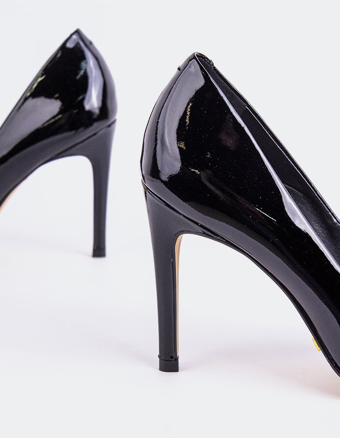 Chic Low Heel Pump
Designed for effortless elegance, this low heel pump offers the perfect balance of style and comfort. Its understated silhouette makes it ideal for both professional and casual settings, while the modest heel provides all-day wearability without compromising on sophistication. A go-to option for polished, everyday wear.

Detail(s):&nbsp;

Pointy Toe
3.75” Straight Stiletto Heel
We recommend sizing up, as this item runs small.

Material(s):&nbsp;

Patent Leather Upper&nbsp;
Padded Leather