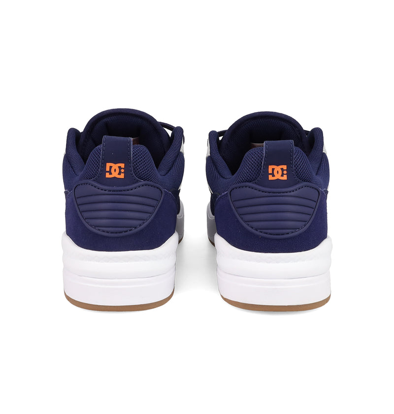Back view of Men's DC Ascend S Shoes by DC Shoes in navy blue with white soles, orange heel logos, and padded collars, highlighting modern comfort and authentic DC style against a white background.