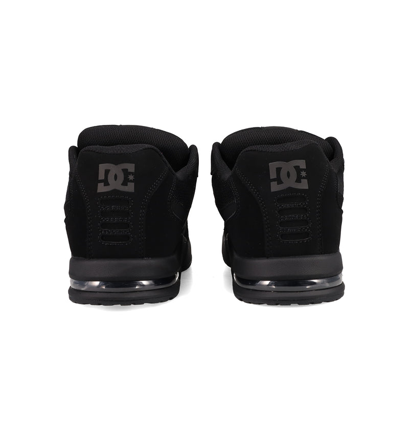 The Men's AT-2 Shoes by DC Shoes are shown from the back, with gray DC logos on each heel, a black sole featuring an airband outsole, and a padded collar.