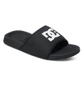 The Men's Bolsa Slides by DC Shoes feature a black design with a textured footbed and a wide strap displaying the white DC Shoes logo—ideal for relaxing after skate sessions.