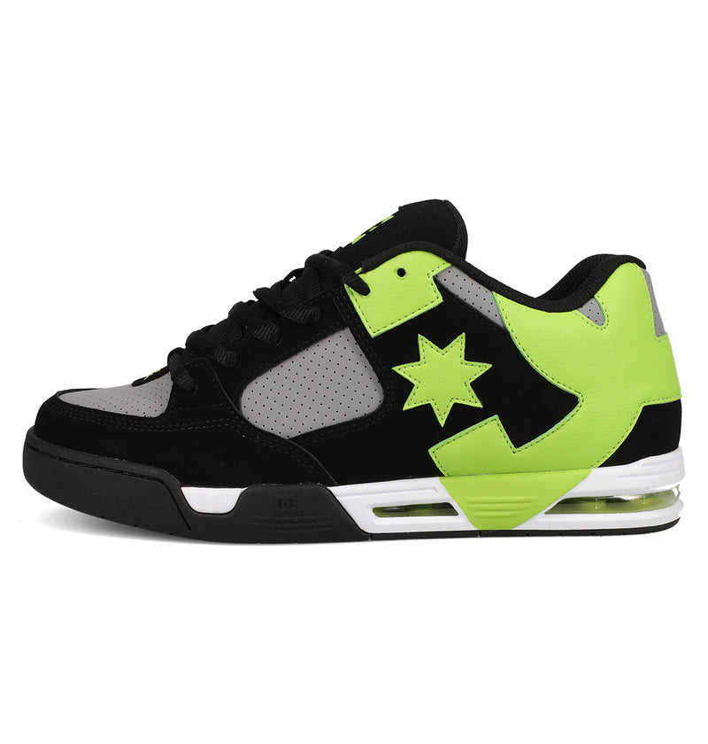 The Men's DC Command Shoes by DC Shoes are black, gray, and neon green low-tops with a perforated toe box, thick sole, star side design, street-ready look, visible heel air cushion, and thick black laces.