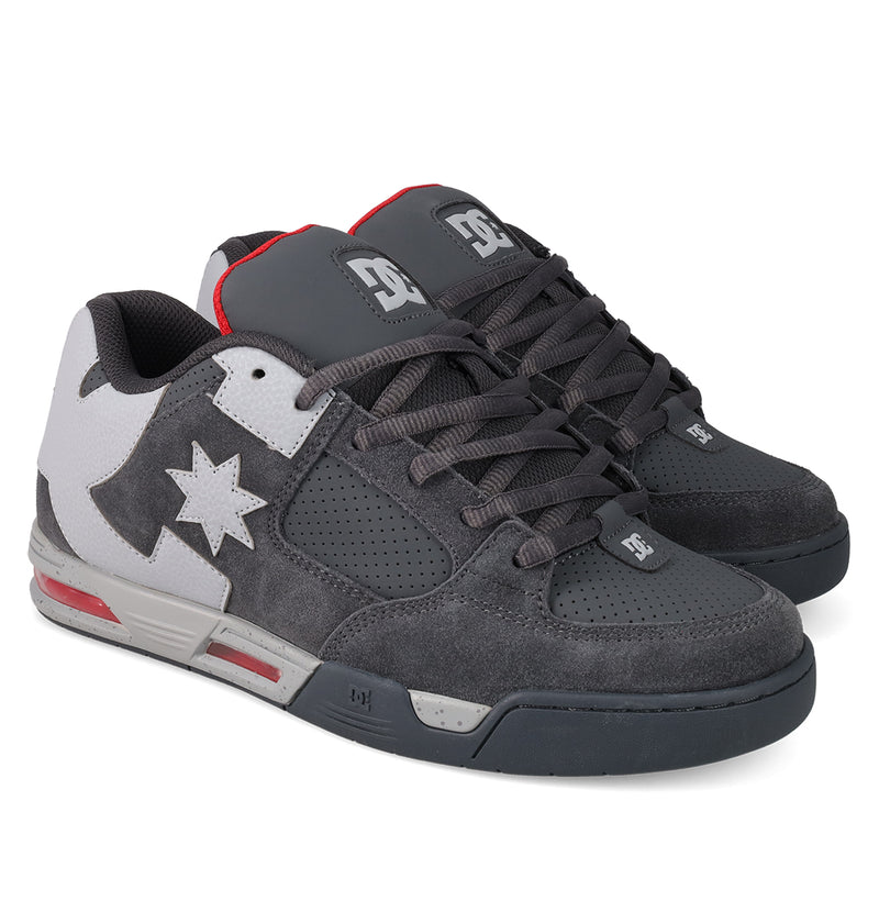 The Men's DC Command Shoes from DC Shoes feature gray and white panels, perforated sides, a white star and lightning bolt detail, gray laces, red midsole accents, and branded logos on the tongue and heel for standout skate style.
