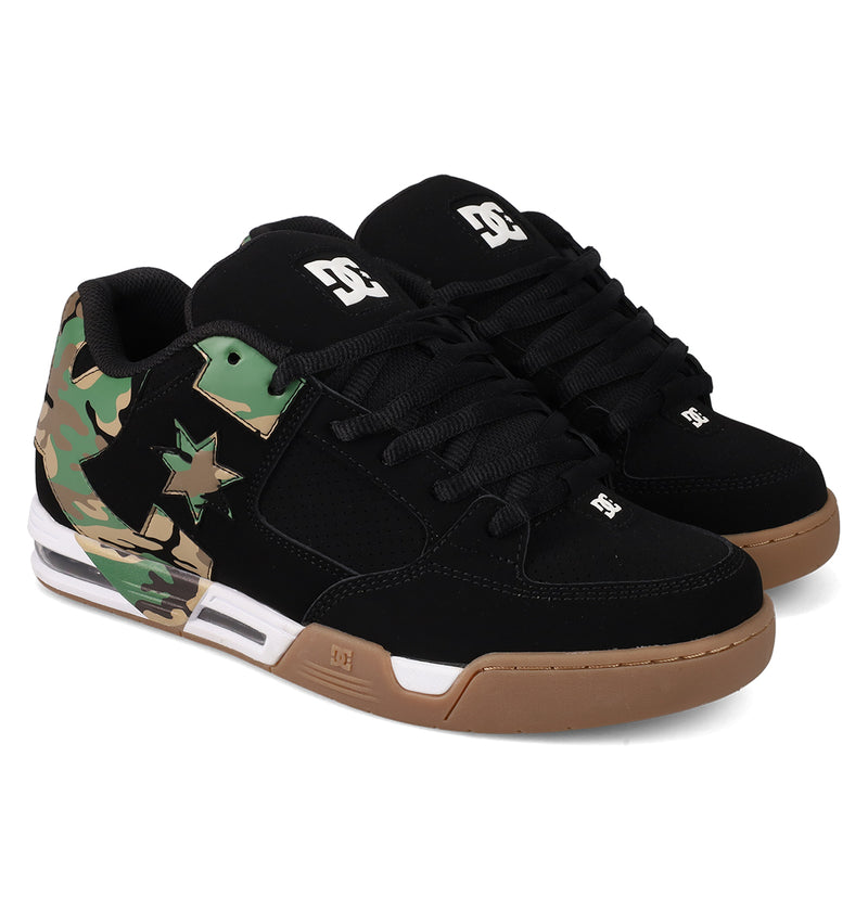 Men's DC Command Shoes by DC Shoes: black low-tops with black laces, brown soles, and camo patterns on the heel and side. Features a star motif and the iconic DC logo for street-ready style inspired by skate heritage.