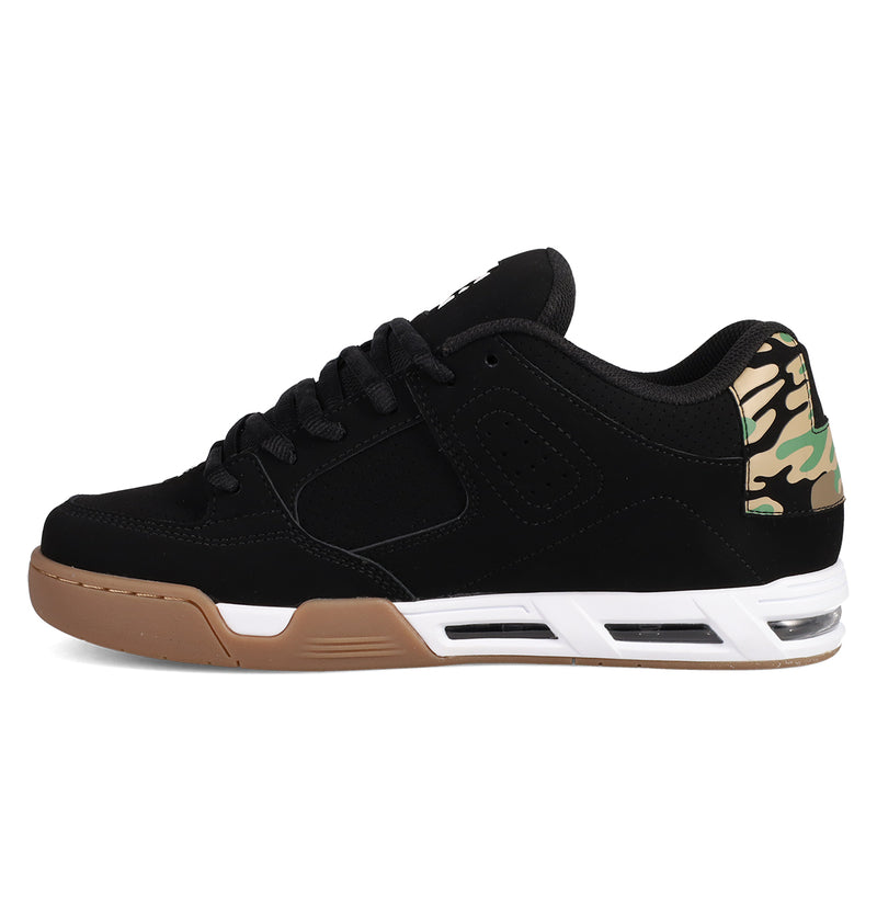 The Men's DC Command Shoes by DC Shoes feature a black low-top design with a brown sole, white midsole accents, and camouflage heel detail, shown on a white background.