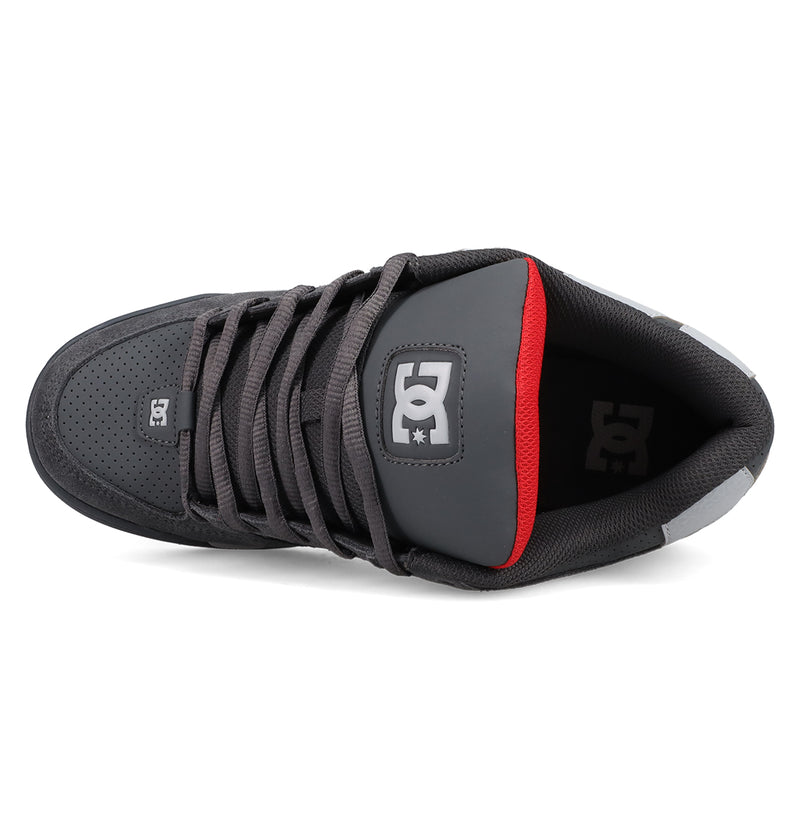 Top view of the Men's DC Command Shoes by DC Shoes in dark gray, featuring black laces, a red inner heel lining, and the iconic DC logo on the tongue—blending classic skate style with street-ready design.