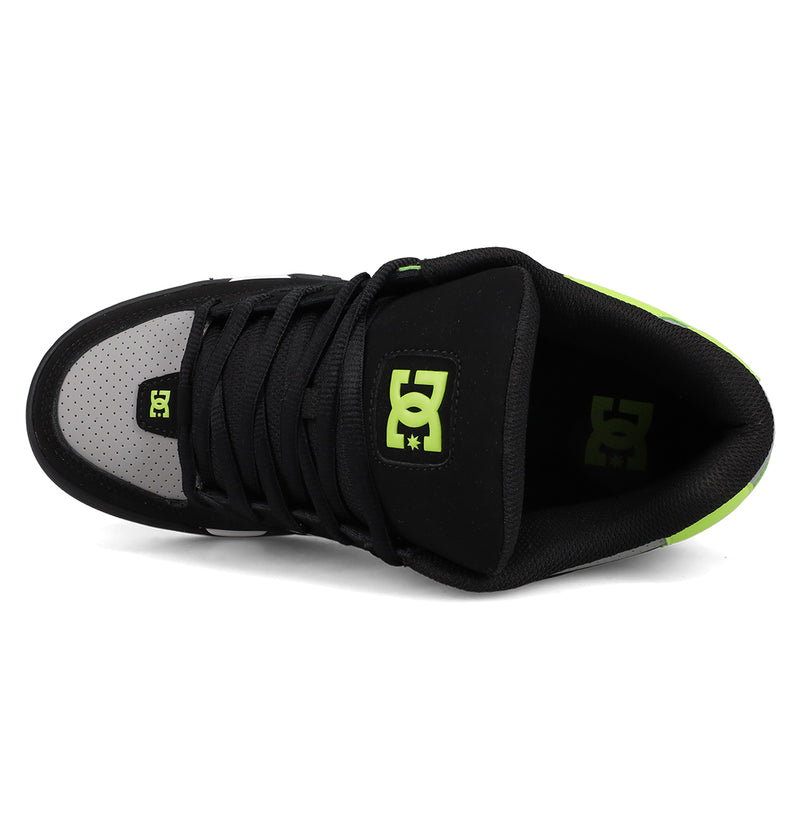 Top view of the Men's DC Command Shoes by DC Shoes, featuring black and gray colors, neon green logo details, black laces, a perforated gray toe area, and a bold design inspired by authentic skate heritage.