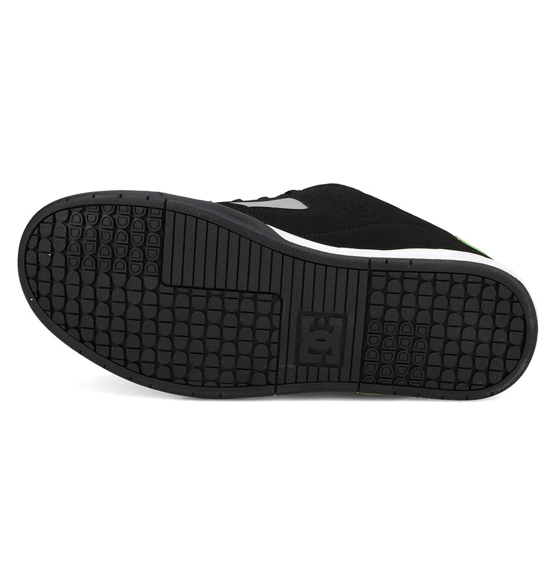 The image displays the black rubber sole of the Men's DC Command Shoes by DC Shoes, featuring a textured tread pattern and an embossed logo at the center, all set against a white background.