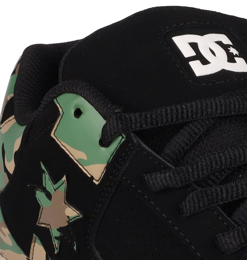 Close-up of Men's DC Command Shoes by DC Shoes, featuring a black skate design with camouflage pattern, star side detail, black laces, a white DC logo on the tongue, and classic skate heritage for street-ready style.
