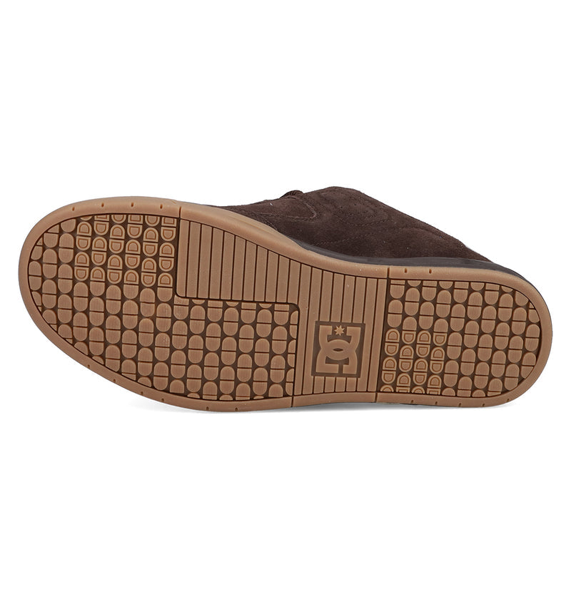 The image shows the sole of the Men's DC Command SE Shoes by DC Shoes, featuring a brown textured tread, rectangular grid at the toe, horizontal midsole lines, and an embossed DC logo near the heel for modern tech and signature cushioning.