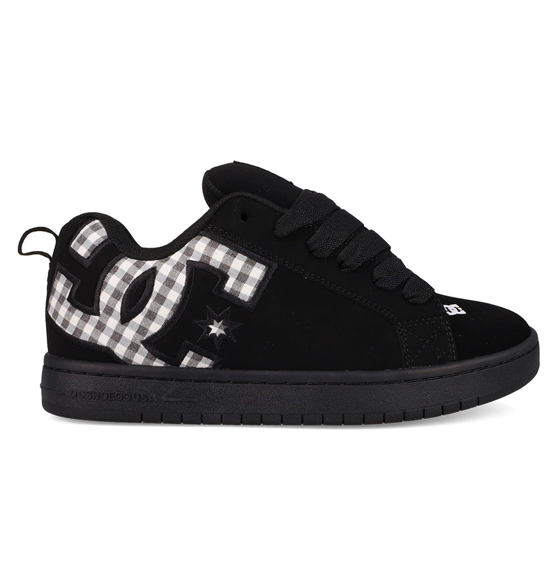The Men's Court Graffik Shoes by DC Shoes feature a classic puffy black silhouette, thick sole, black laces, and a bold black-and-white plaid DC logo with a subtle star detail on the side.