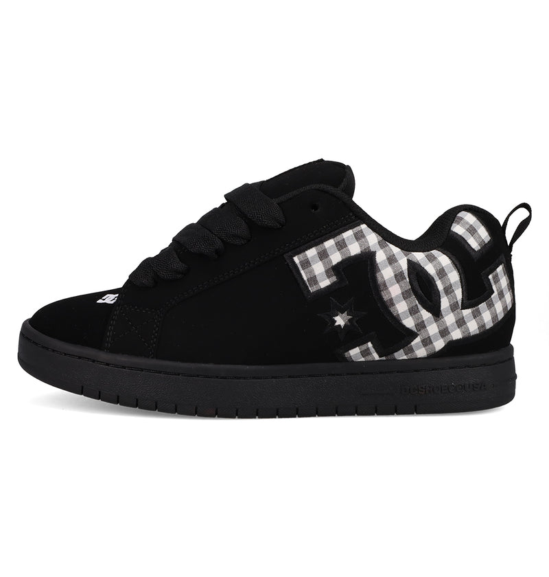 The DC Shoes Men's Court Graffik features a classic puffy black skate silhouette, thick laces, a bold black-and-white plaid DC logo on the side, and a solid black sole.