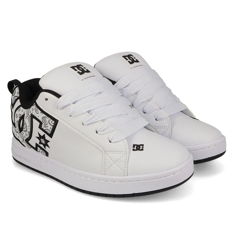 A pair of DC Shoes Men's Court Graffik Shoes in white, featuring a puffy silhouette, thick white laces, black inner lining, bold DC logo, black-and-white side graphics, and white soles with contrasting black outsoles.