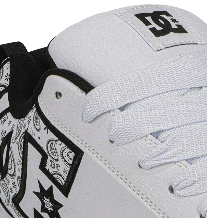 Close-up of DC Shoes Men's Court Graffik, showcasing a puffy white silhouette with black and white paisley inside the bold DC logo, white laces, and black trim accents.