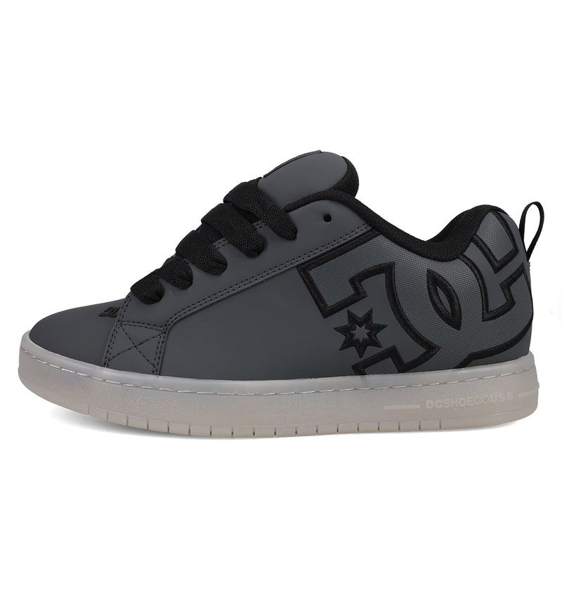 The Men's Court Graffik SE Shoes by DC Shoes feature a dark gray, puffy silhouette with black laces and detailing, a prominent DC Shoes logo on the side, and a white sole with subtle branding near the heel.