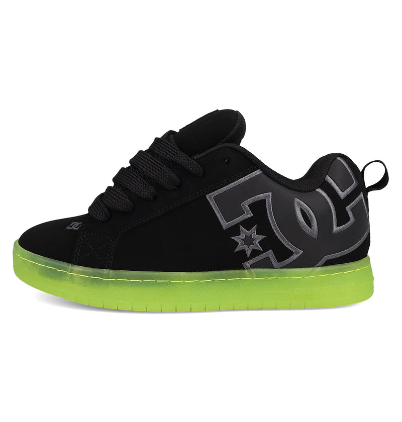 The DC Shoes Men's Court Graffik SE features a puffy black silhouette, thick black laces, a bold grey logo on the side, and a bright neon green translucent sole for classic comfort and street-ready style.
