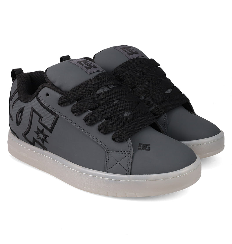 The Men's Court Graffik SE Shoes by DC Shoes feature a gray puffy silhouette, black laces and lining, black DC logos on the side and tongue, and white rubber soles.