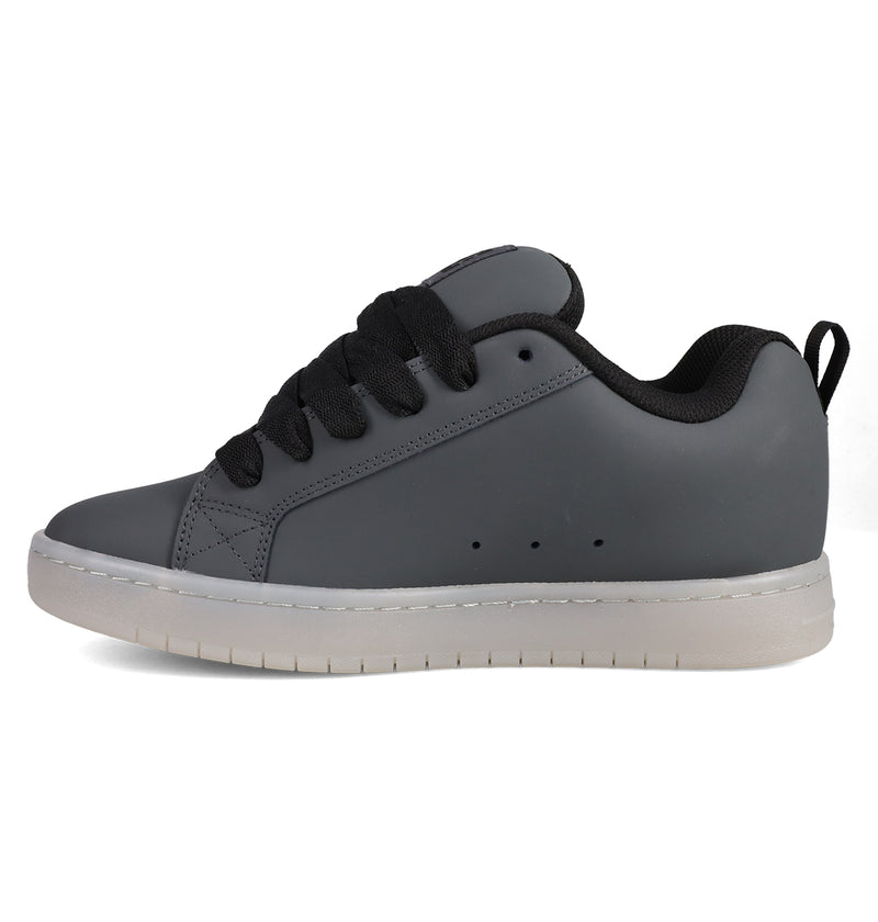 The DC Shoes Men's Court Graffik SE is a gray sneaker with black laces and a white sole, featuring a puffy silhouette and premium upper, shown in left side profile against a white background.