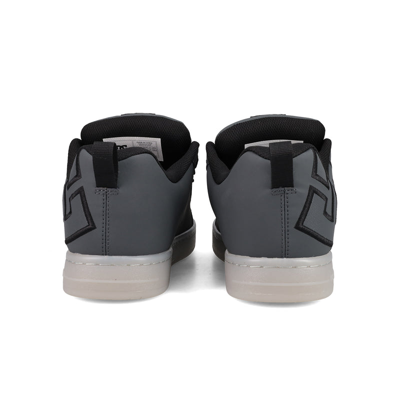 The Men's Court Graffik SE Shoes by DC Shoes feature a puffy silhouette, premium upper materials, gray color with white soles, black geometric heel designs, and black inner lining for an elevated look.