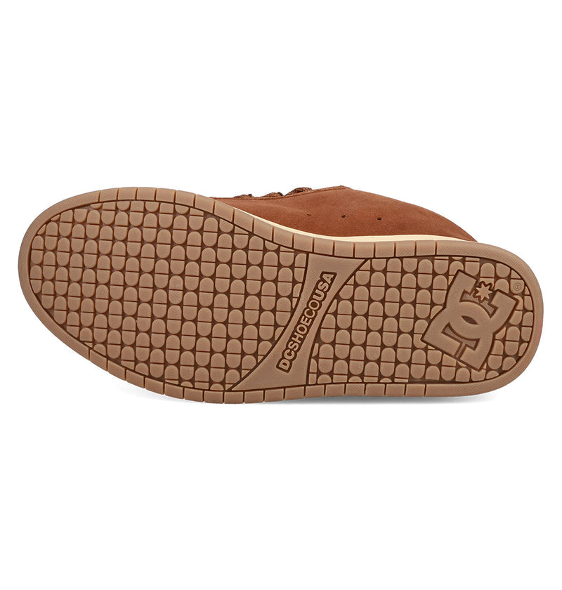 The image features the sole of the Men’s Court Graffik SE Shoes by DC Shoes, showing a textured tread pattern, DCSHOECOUSA branding at the center, and a DC logo near the heel—emphasizing its puffy silhouette and premium upper.