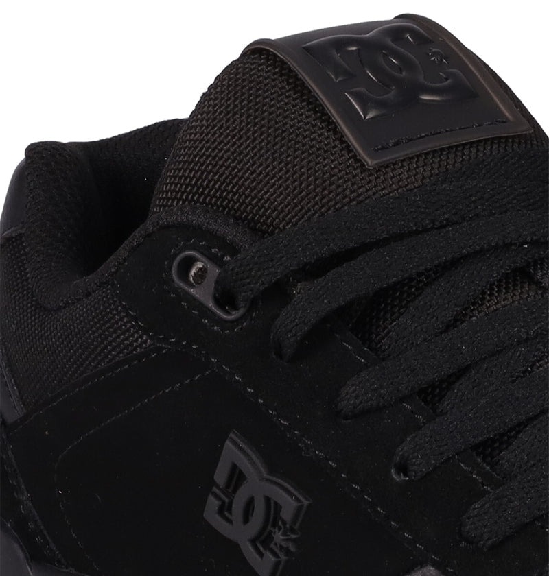 Close-up of the Men's Fractal Shoes by DC Shoes in black, featuring mesh and suede textures, laces, a raised DC logo on the tongue, and a side logo—delivering street-ready style with performance-driven comfort.