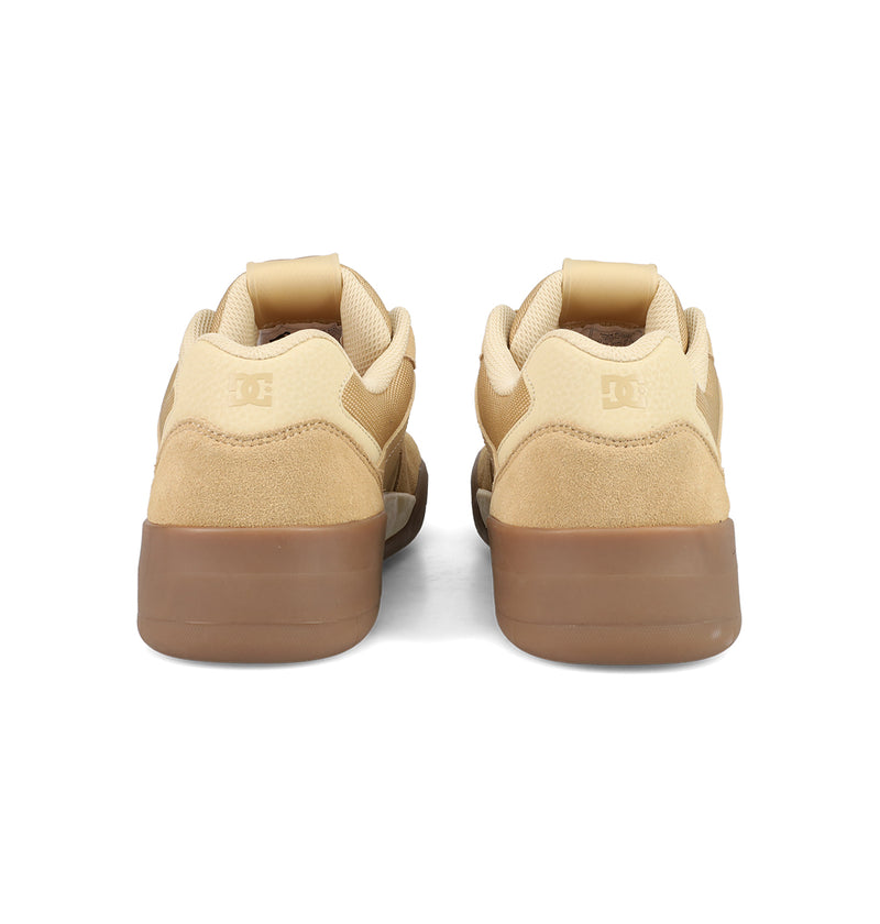 The DC Shoes Men's Fractal S sneakers, in tan and brown suede, feature rubber soles and embossed heel logos, blending street-ready style with the comfort-focused design of the Fractal line.