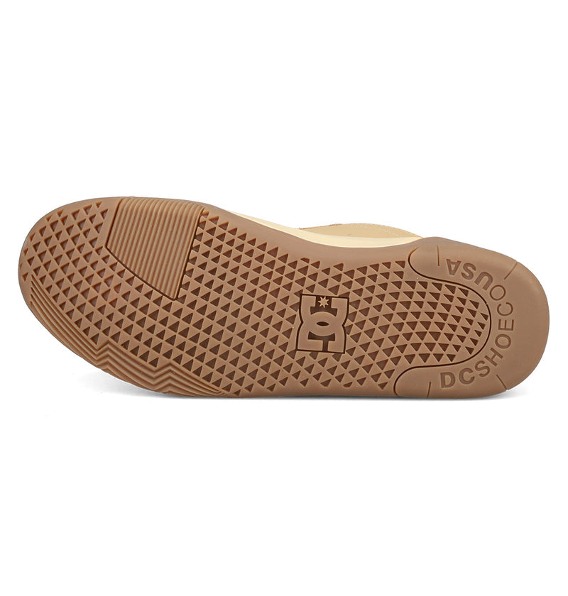 The image displays the gum rubber outsole of DC Shoes Men's Fractal S, featuring a textured tread, central DC logo, and embossed "USA" and "DCSHOECO" near the heel for signature street-ready style.