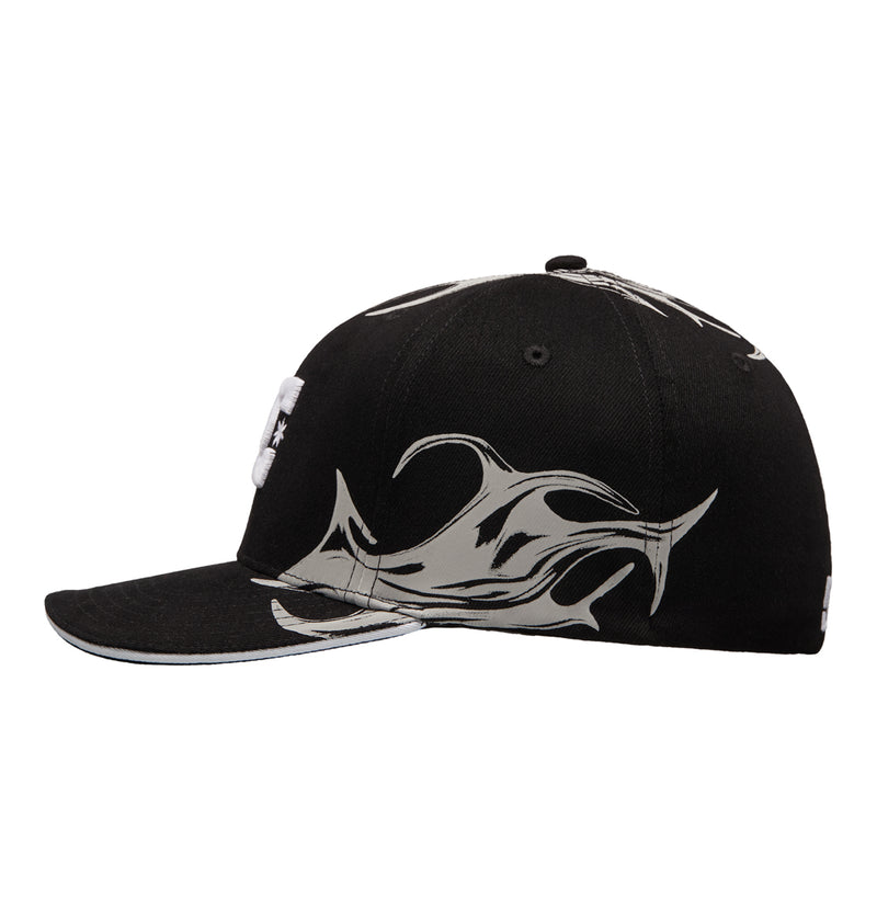 The Reebok Fuego Cap is a black baseball cap with a flat brim, featuring abstract silver flame-like designs along the side and brim.