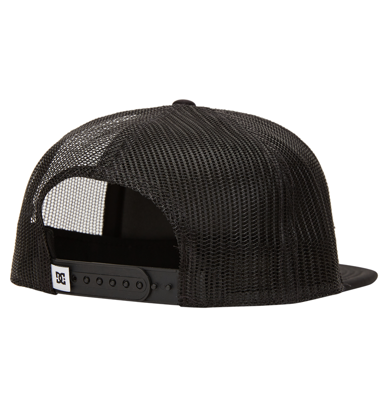 The DC Shoes Men's Gas Station Trucker Hat in black is shown from the back, featuring mesh panels for breathability, an adjustable snapback closure, and a small rectangular logo tag on the strap's left side.
